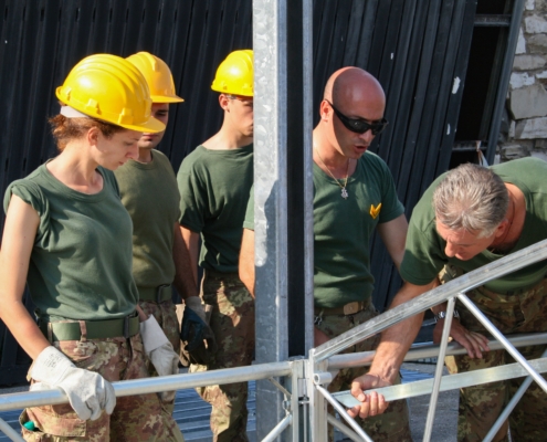 Team of Builders in Yellow Safety Helmets