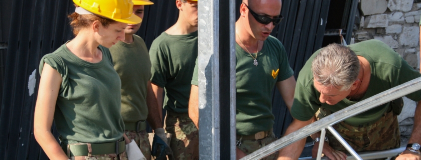 Team of Builders in Yellow Safety Helmets